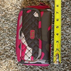 Lug Wallet in pink camo. 7 1/2” x 4”. Excellent condition.